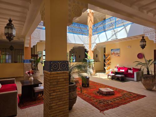 a living room with a large room with a living room at Kasbah Ntifa in Ouzoud