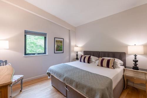 a bedroom with a bed and a window at Charlie in Richmond