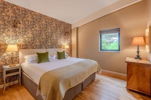 a bedroom with a large bed and a window at Flora in Richmond
