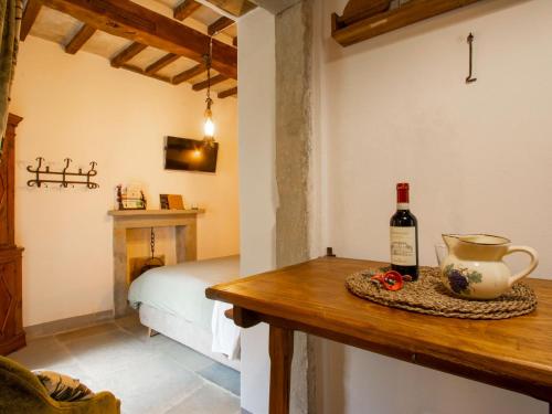 a bottle of wine on a table in a room at Apartment Cia by Interhome in Palazzuolo sul Senio