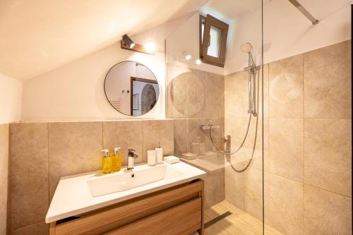 a bathroom with a sink and a shower at Arsenal Park Transilvania in Orăştie