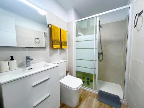 a bathroom with a shower and a toilet and a sink at playa honda sky view in Playa de las Americas