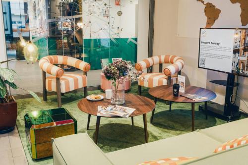 a room with chairs and tables in a store at The Social Hub Paris La Défense in Puteaux