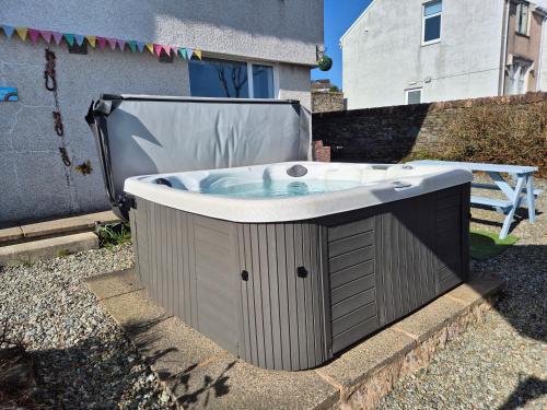a hot tub in the backyard of a house at Firthview House great for families with children pet friendly in Kirn