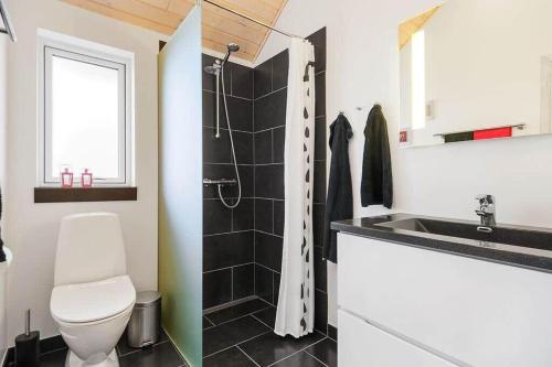 a bathroom with a toilet and a sink at K19082-Kalundborg-Sandlodsvej-18 in Asnæs