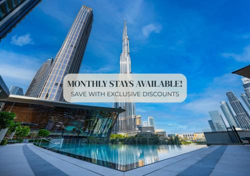 a sign that reads mountain stays available save with expensive downtown at SmartStay at Grande Signature - Downtown Dubai City Views - Brand New Luxury Apartments in Dubai