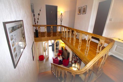 a staircase in a house with a living room at Les Alisiers in Nadrin