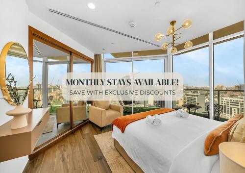 a bedroom with a bed and a large window at SmartStay at Zaya Hameni - Modern Luxury Apartments - Unique in JVC in Dubai