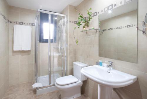 a bathroom with a toilet and a sink and a shower at Andorra4days Soldeu - El Tarter in Soldeu