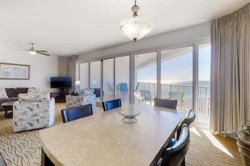 a living room with a dining table and a living room at TOPS'L Tides II in Destin