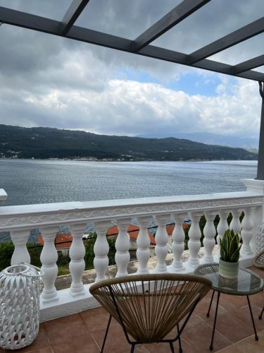 a balcony with a view of the water at Samos Blue Haven in Samos