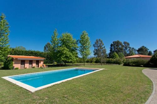 a swimming pool in the yard of a house at GuestReady - Tranquillity in Baião in Baião