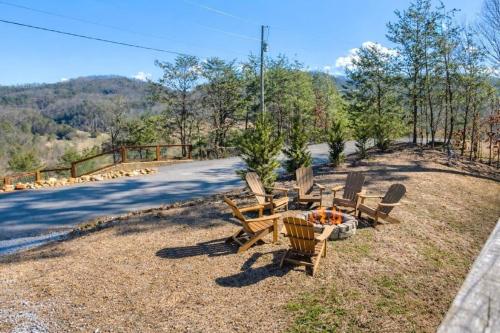 a group of chairs sitting on the side of a road at Makin' Memories cabin in Sevierville