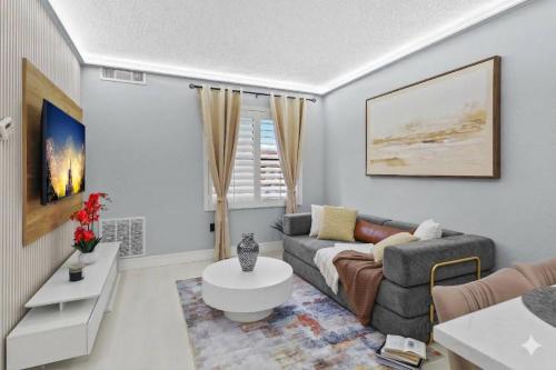 a living room with a couch and a table at Spacious 1BR near Universal I-Drive in Orlando