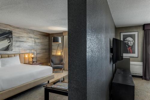 a hotel room with a bed and a tv at Revere Hotel Boston Common in Boston