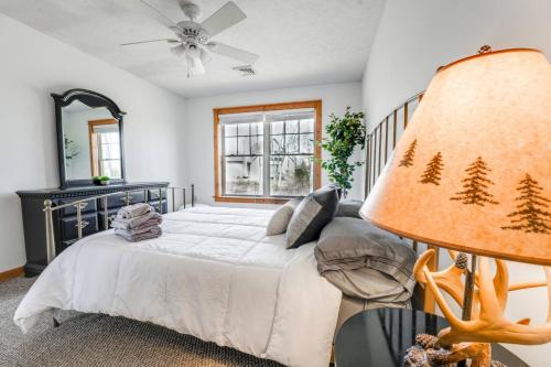 a bedroom with a large bed and a lamp at A Blind Camelback Mtn views 2m to slopes in Tannersville