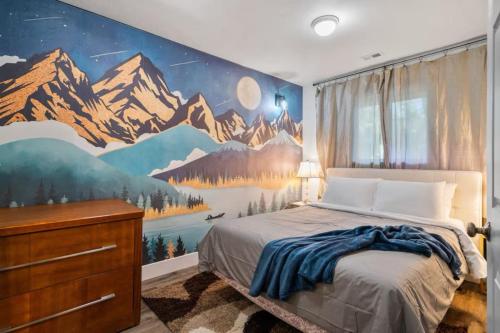 a bedroom with a mountain mural on the wall at Phoenix Lake Sonora in Sonora