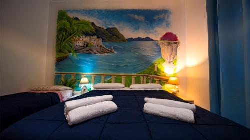 a bedroom with a bed with a painting on the wall at Bed Rho Fiera - Milano Galeazzi in Rho