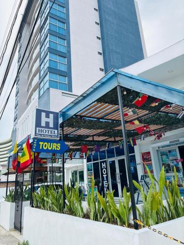 a hotel tours sign in front of a building at Mar de Indias House in Cartagena de Indias