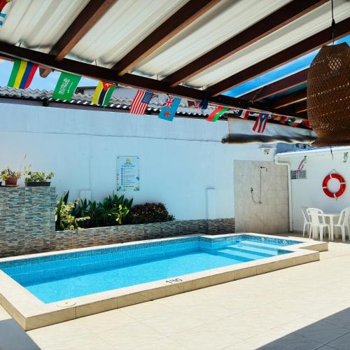 a swimming pool in the middle of a house at Mar de Indias House in Cartagena de Indias