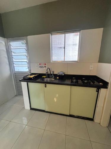 a kitchen with a sink and a counter top at Residencial Junino do Mestre - Casa 66 in Caruaru