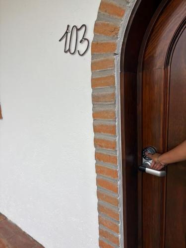 a person standing at the door of a building at Hotel Boutique Santa Teresa in Tlazcalancingo