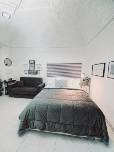a bedroom with a bed and a couch at Marinella House Napoli centro Piazza Dante in Naples