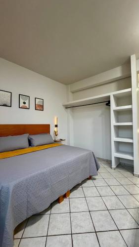 a bedroom with a large bed and a closet at Star Department We bill in La Paz