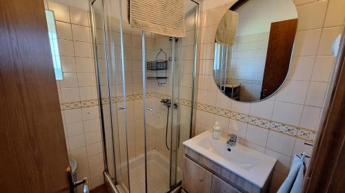 a bathroom with a shower and a sink at Monte Sardão in Cavaleiro