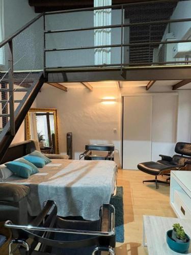 a large room with a bed and a loft at El Patio del Convento in Toledo