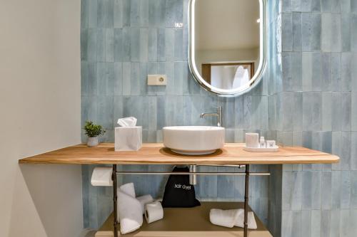 a bathroom with a sink and a mirror at Santa Barbara by Santas Hotels in Altea