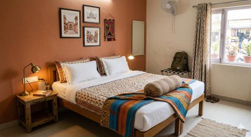 a bedroom with a bed and a window at Hotel Taj Vista by Navodyans Near Taj Mahal in Agra