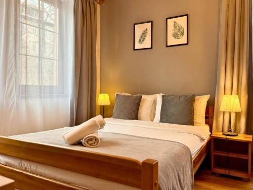 a bedroom with a bed with a towel on it at Willa Maya in Karpacz