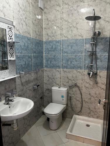 a bathroom with a toilet and a sink at Appartement Moderne à coté de la plage - Essaouira in Essaouira