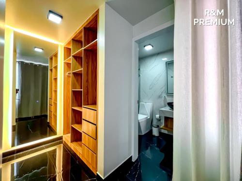 a bathroom with a toilet and a sink at R&M Premium in Baños