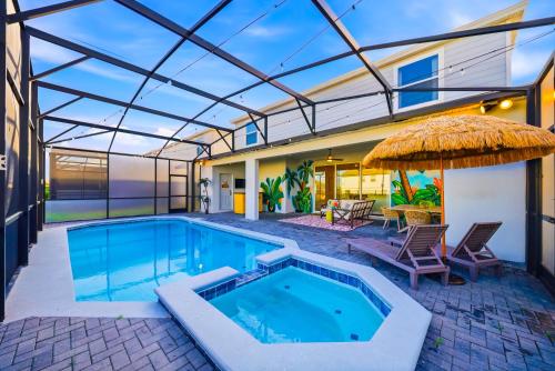 a swimming pool with a patio and a house at Windsor Resort Private Pool & Theater Game Room in Davenport