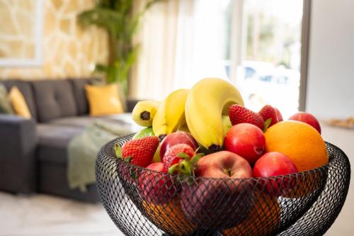 a bowl of fruit on a table in a living room at Villa Renata in Kontokali