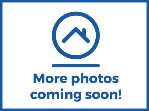 a sign that says more photos coming soon at 54 George Street in Mablethorpe