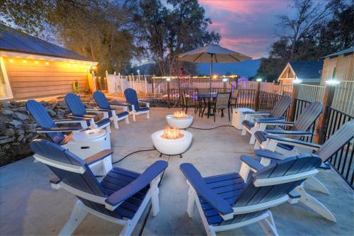 a group of chairs sitting around a fire pit at Splash Mountain in Oakhurst