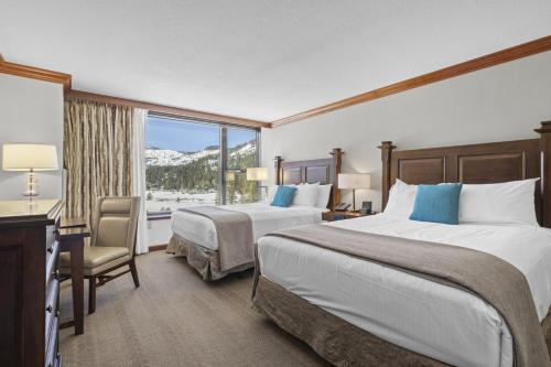 a hotel room with two beds and a window at Resort Perks! Everline Corner Retreat w/ 3 Units in Olympic Valley
