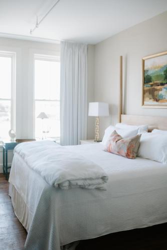 a bedroom with a large white bed with a window at The St Nicholas Hotel in Albany