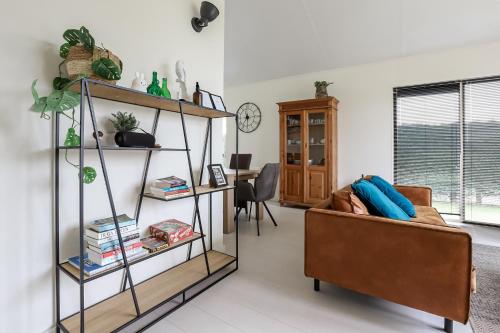 a living room with a couch and a table at Rekerlanden 275 in Warmenhuizen