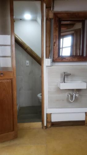 a bathroom with a sink and a toilet at Torre de Guadua in Medellín