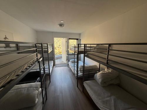 a group of bunk beds in a room at Open Water Lodge Smögen in Smögen