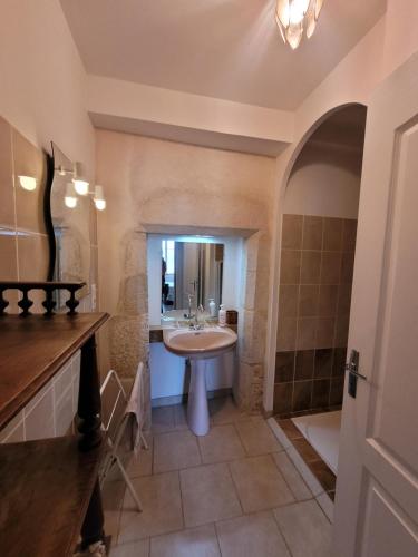 a bathroom with a sink and a shower at Gîte de La Rev'rie in Montalembert