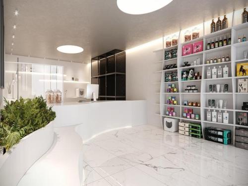 a white room with a counter and shelves with bottles at Flat em Porto life Resort in Porto De Galinhas