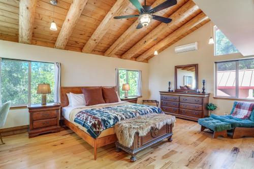 a bedroom with a bed and a ceiling fan at Walk to Pine Mountain Lake: Spacious Family Cabin in Groveland