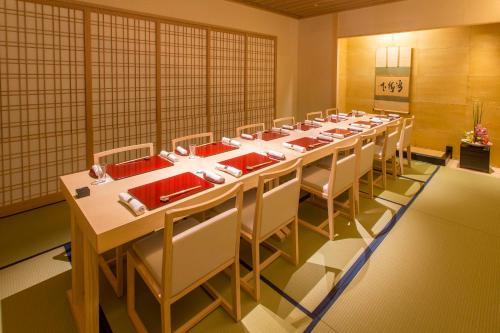 a large room with a long table and chairs at Royal Park Hotel Takamatsu in Takamatsu