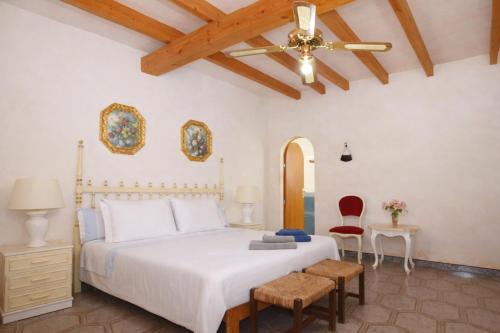 a bedroom with a bed and a ceiling fan at 409 Villa Can Bril ETV1523 by Mallorca Charme in Campos