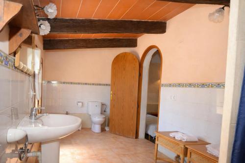 a bathroom with a sink and a toilet at 409 Villa Can Bril ETV1523 by Mallorca Charme in Campos